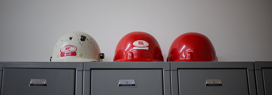 An image of B-G Mechanical branded hard hats in a row
