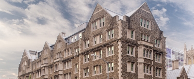 Exterior view of a large, stone building.