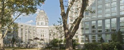 Exterior of a large complex with an octagon peak in the corner.